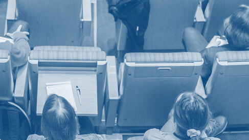 A photo from above of audience members in a lecture theatre