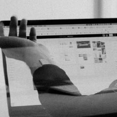 A photo of students working online in a quiet library working space