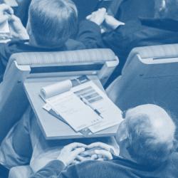 A photo from above of audience members in a lecture theatre