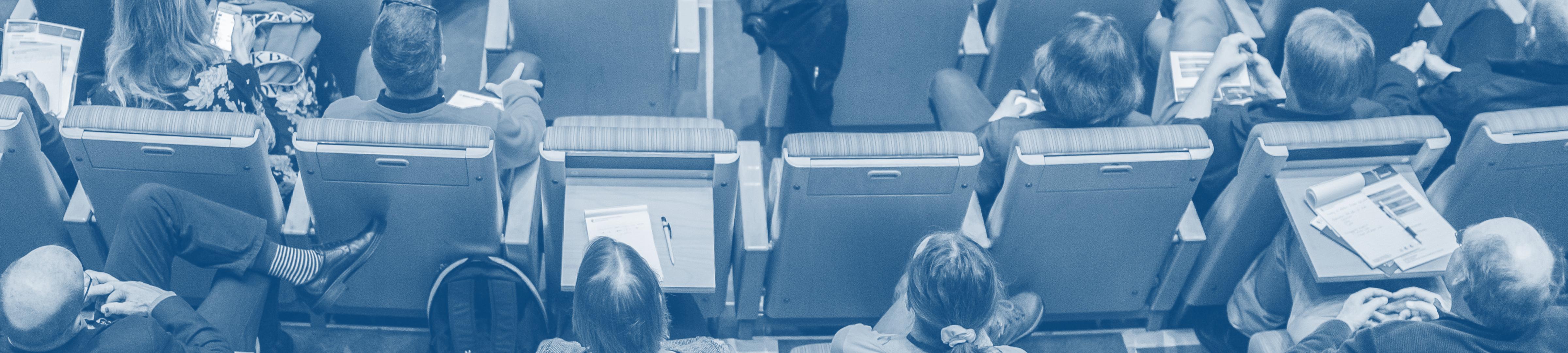 A photo from above of audience members in a lecture theatre